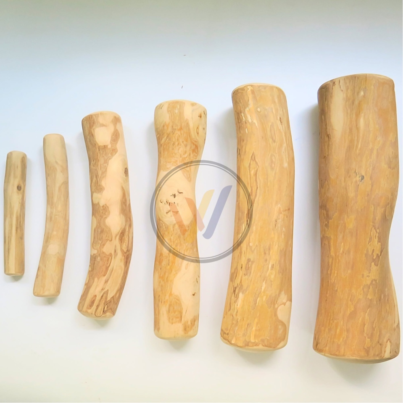 Coffee wood dog chews in six sizes, from extra small to extra large